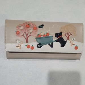 Charming Beige Wallet with Dog and Wheelbarrow Design